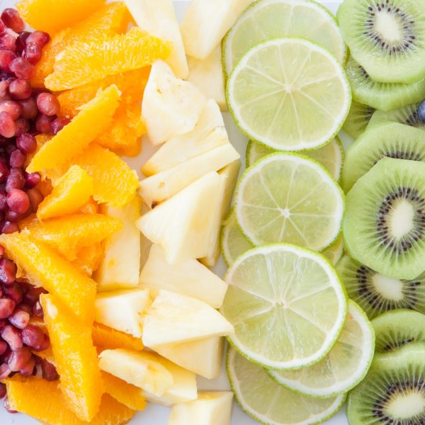 Colorful background made from fresh fruits in rainbow colors