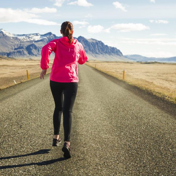 Shot of a beautiful woman running in a beautiful afternoon